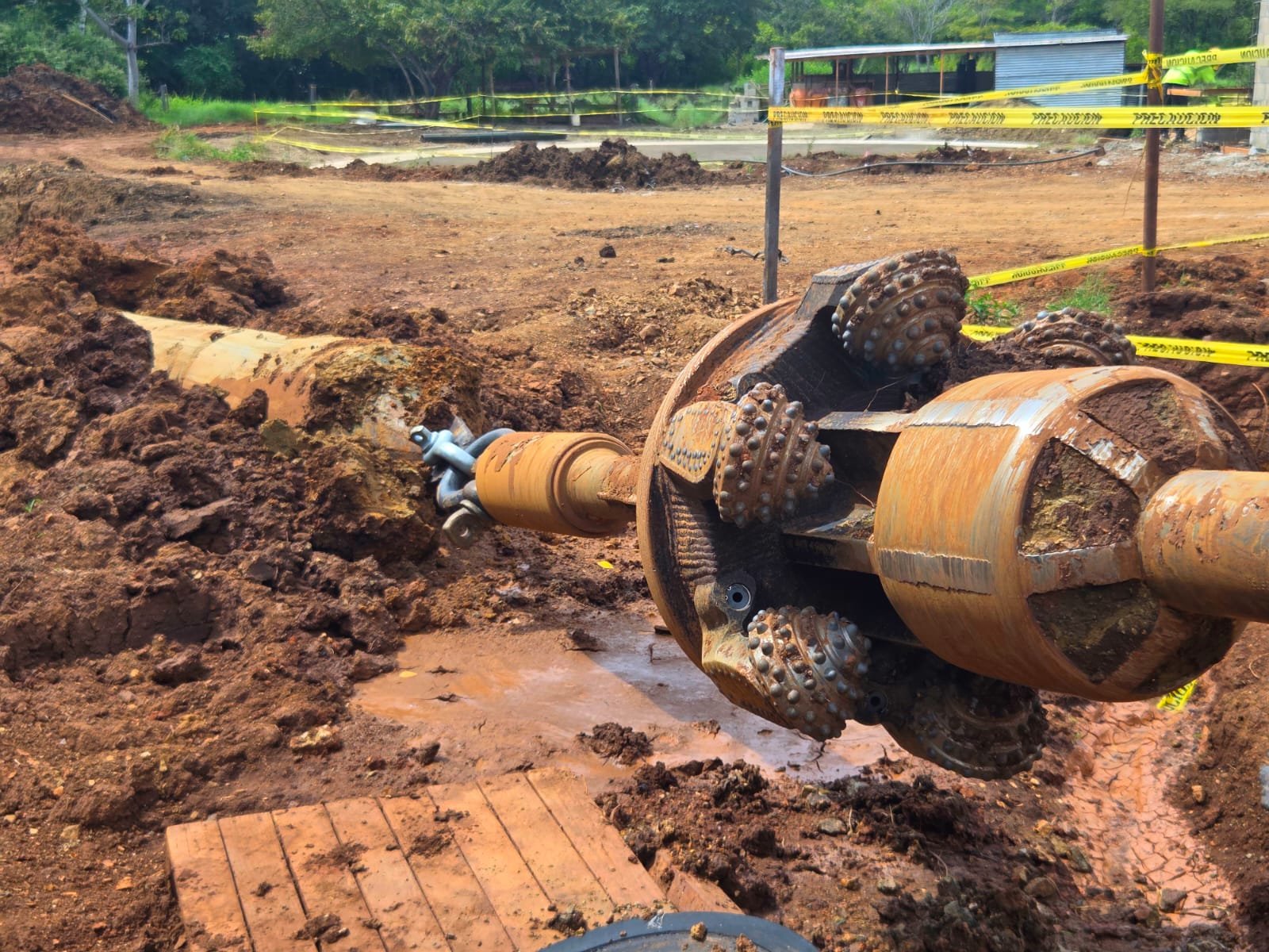 Hole opener for rock drilling at a construction site
