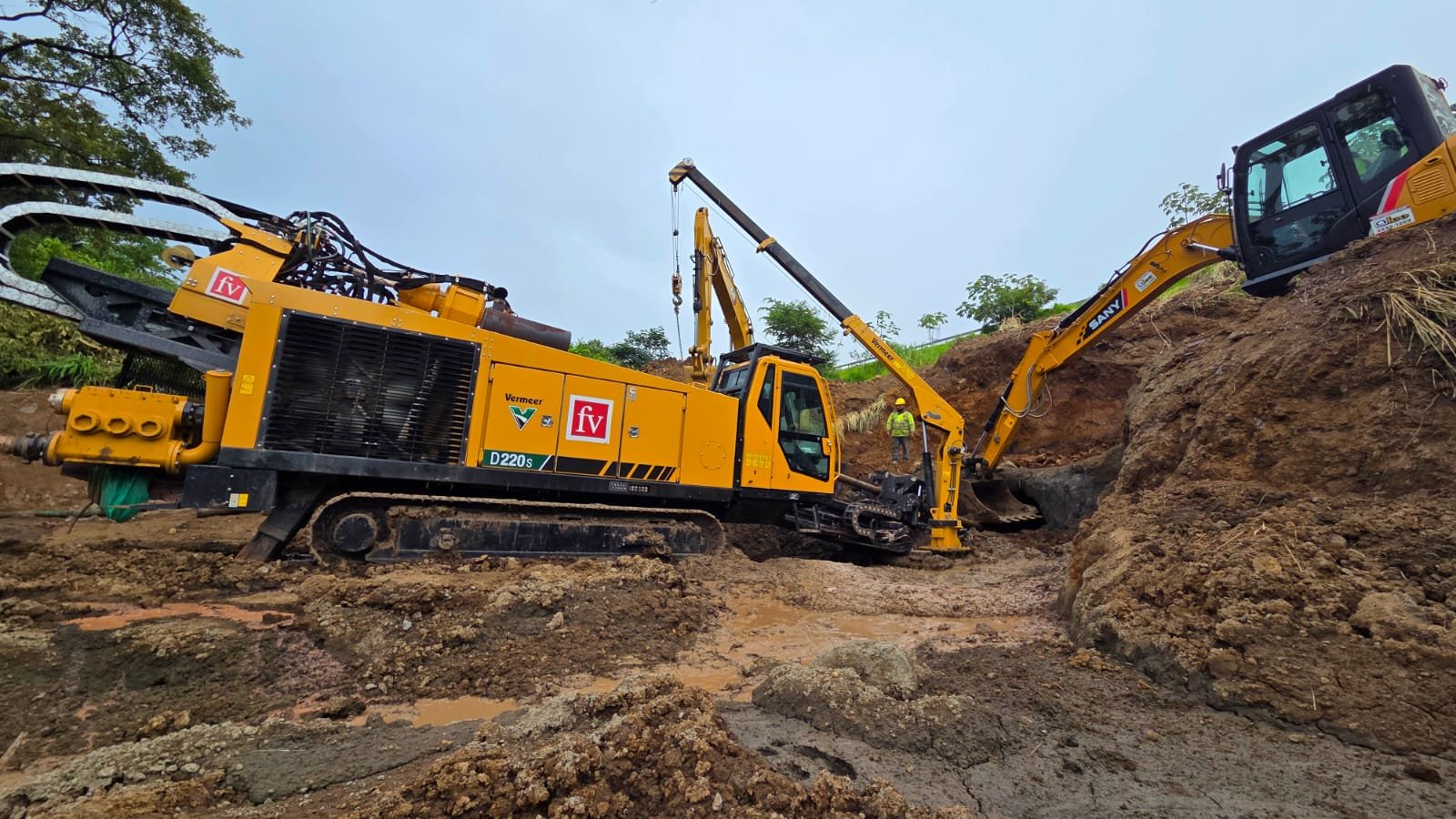 Drilling rig and excavators at the Route 27 crossing work site
